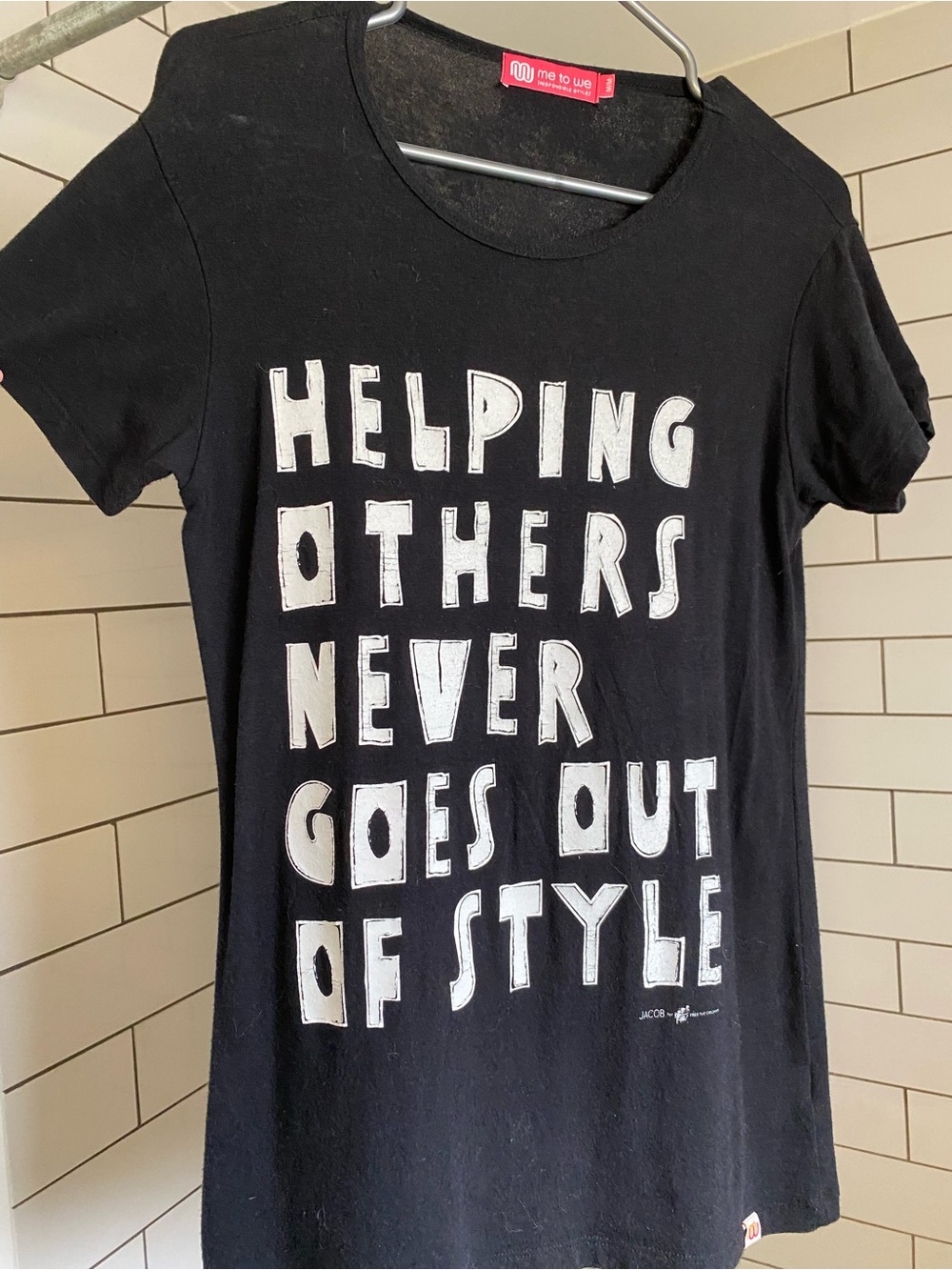 Me to We Black Tee with White Block Slogan